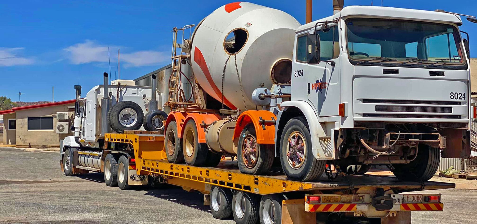Tow truck towing cement truck NT